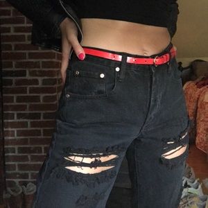 Distressed grungy bf jeans w tear under butt